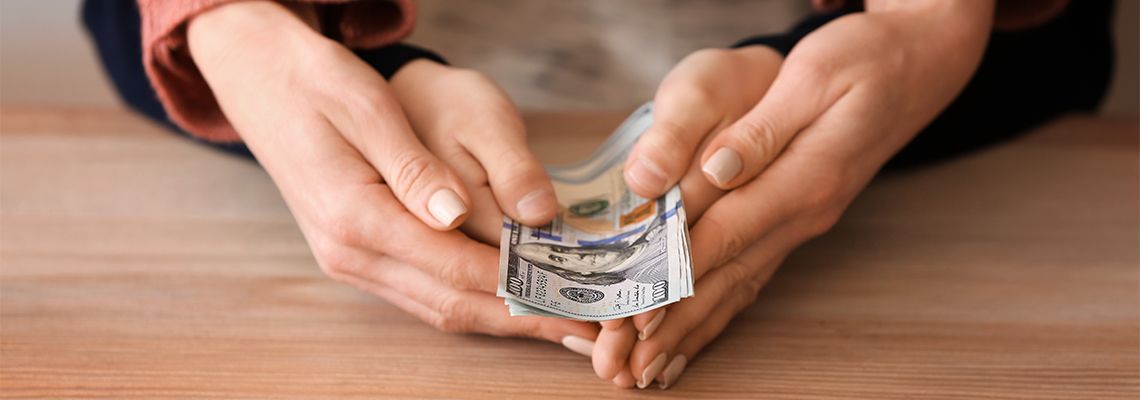 Women with her child holding dollar bank notes